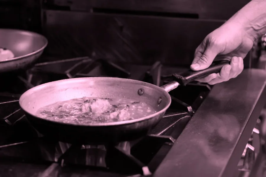 Kitchen staff recording temperatures